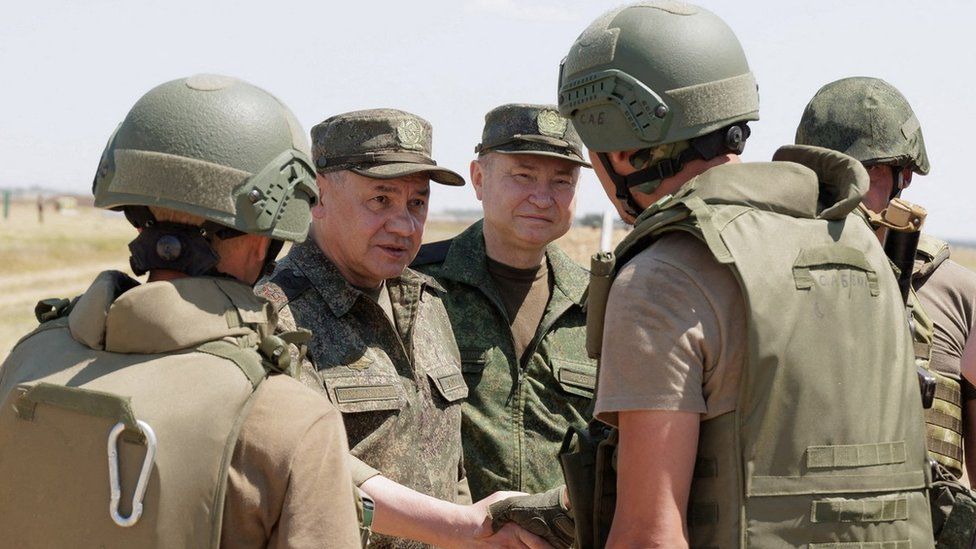 Russia's Defence Minister Sergei Shoigu inspects troops at a shooting range in the country's Southern Military District