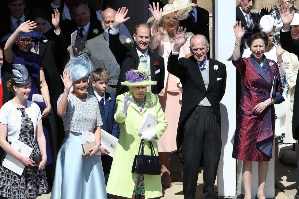 The Queen, Duke of Edinburgh and other members of the Royal Family wave at the Duke and Duchess of Sussex's wedding in May 2018