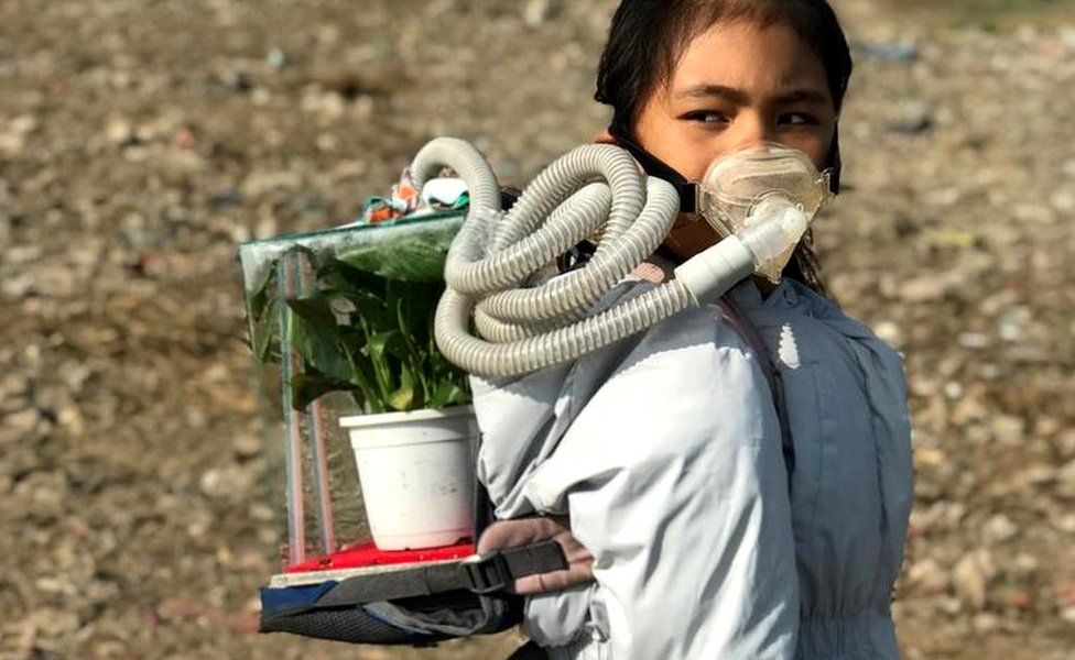 Licypriya wears her symbolic Sukifu (Survival Kit for the Future) to promote the need to curb air pollution