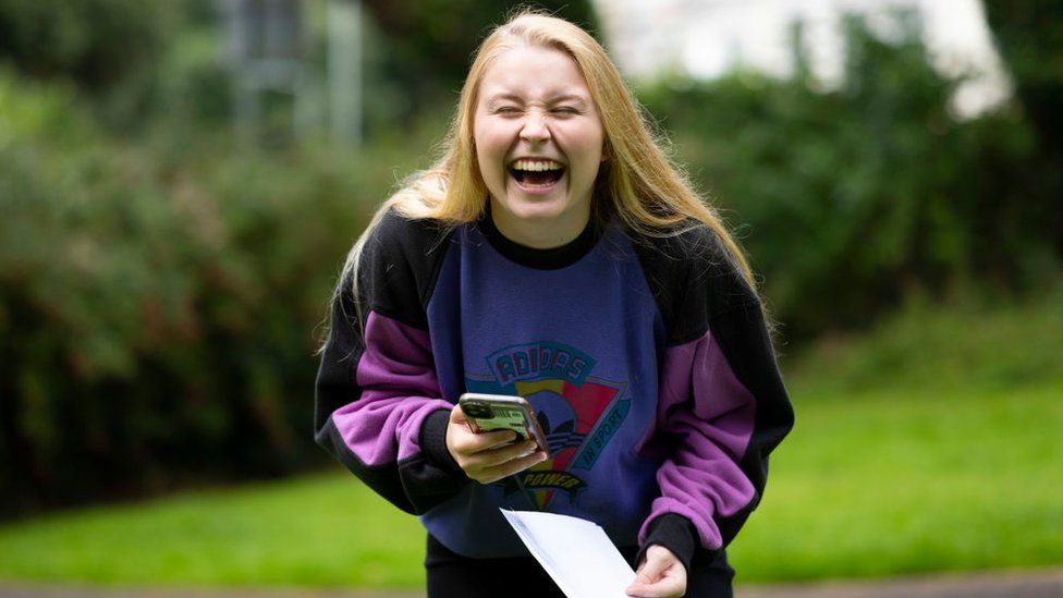 Georgia Davies laughs after opening her A Level results at Ffynone House school