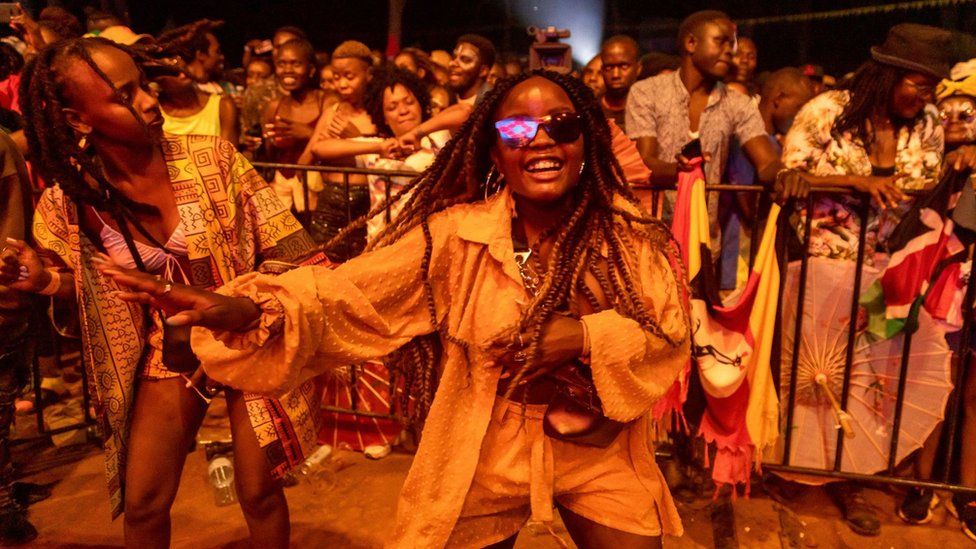 Ugandan Nyege Nyege festival-goers enjoy music played by Lady Hash at the Itanda Falls on the Day two of Nyege Nyege festival, the annual four-day international music festival, in Jinja, Uganda on September 16, 2022