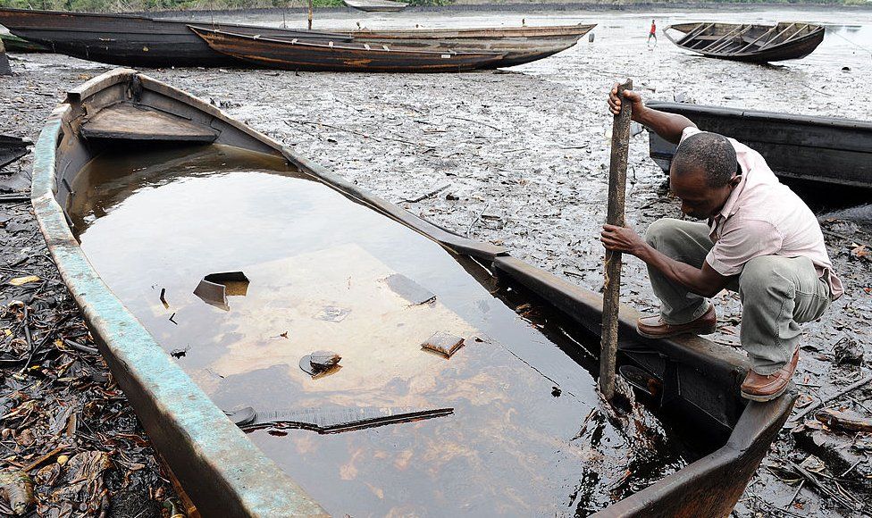Fishing canoes on polluted creek