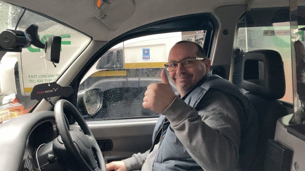 Cabbie with thumbs up