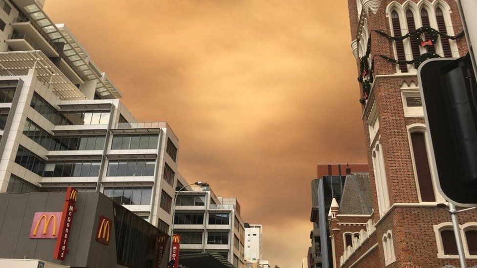 Orange skies from a bushfire over the Perth city centre