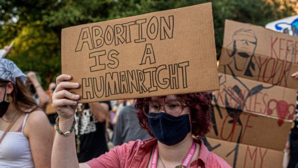 Pro-choice protesters march outside the Texas State Capitol on Wednesday on 1 September