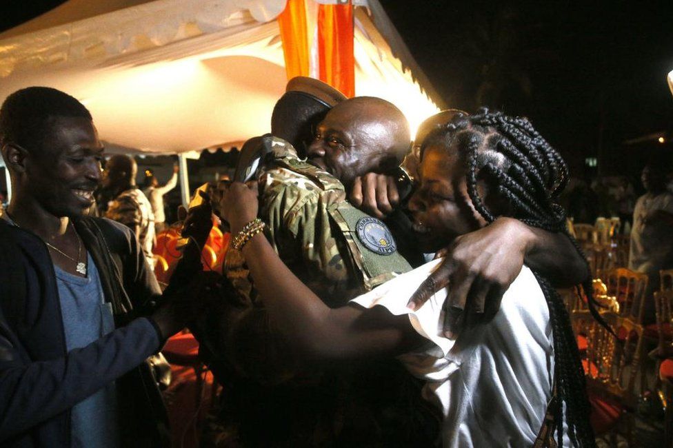 One of the 46 Ivorian soldiers who was arrested in July in Mali is welcomed by his family after a ceremony at Abidjan airport, in Ivory Coast - Saturay 7 January 2023