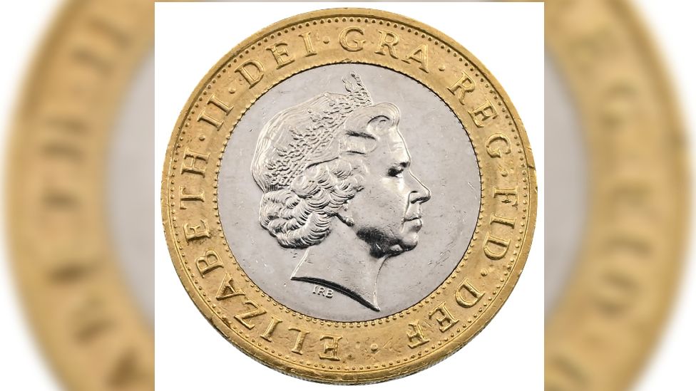 The heads side of the coin, showing the image of the late Queen Elizabeth II with text round the edge which misses out the words two pounds