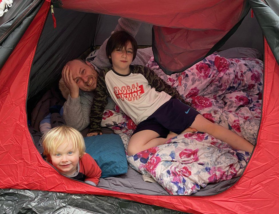 Baxendale family in a tent
