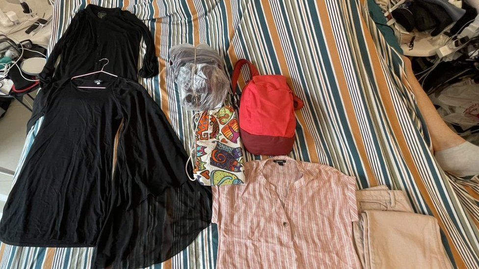 Teresa selects items she intends to swap for everyday goods