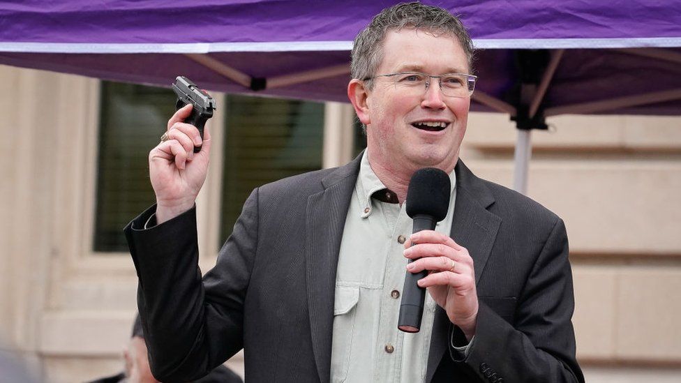 Rep. Massie draws a handgun from his pocket during a rally in support of the Second Amendment on January 31, 2020