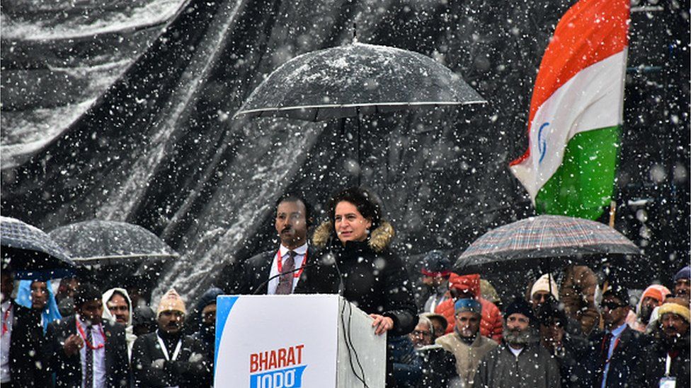 Priyanka Gandhi, general secretary of Indian National Congress and sister of leader Rahul Gandhi addresses the crowd (not pictured) as it snows on the last day of 'Bharat Jodo Yatra' march in Srinagar