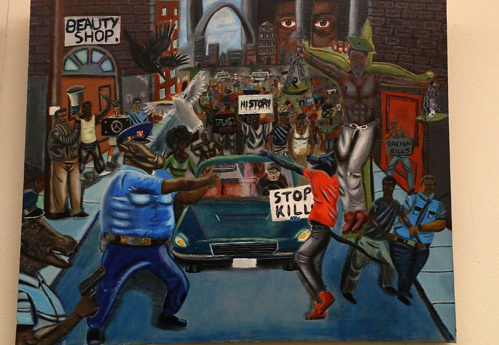 The painting depicts two police officers as pigs, and a protester as a wolf.