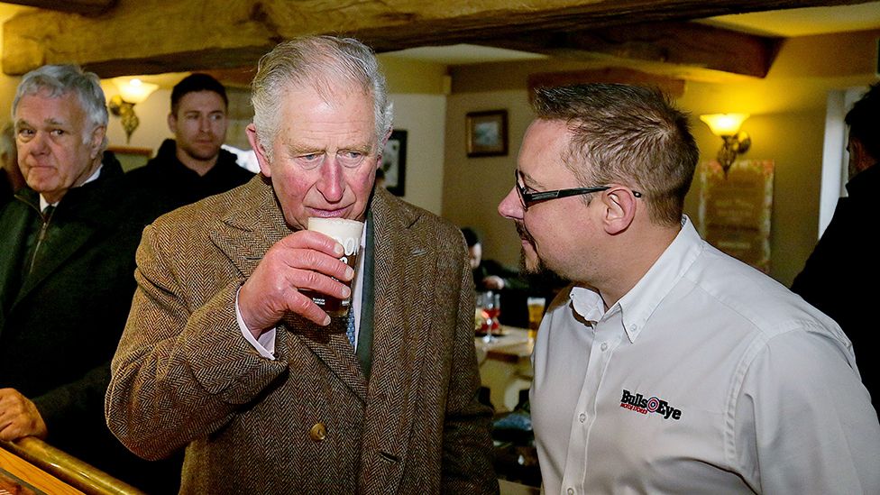 Prince Charles drinking beer