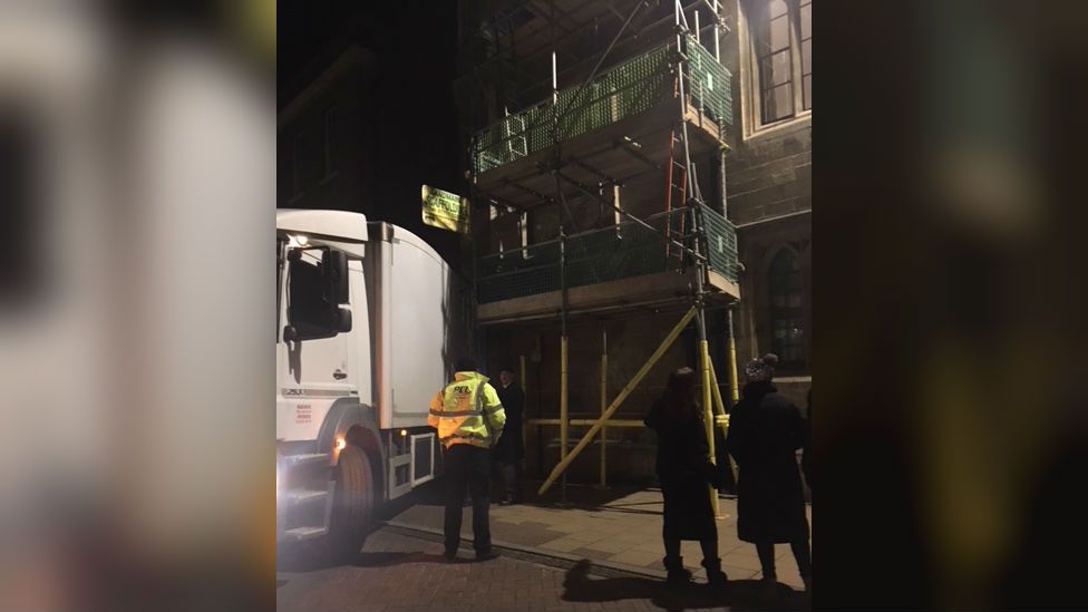 Lorry stuck on scaffolding