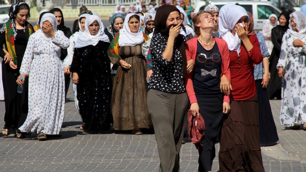 Women mourn during a funeral ceremony for three Turkish Kurdish men, who were killed during clashes between security forces and PKK on Friday, in the south-eastern town of Silopi in Sirnak province, Turkey, 8 August 2015