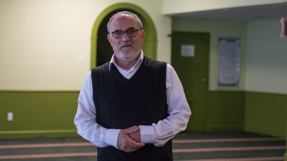 Mohamed Labidi stands inside the mosque's prayer room