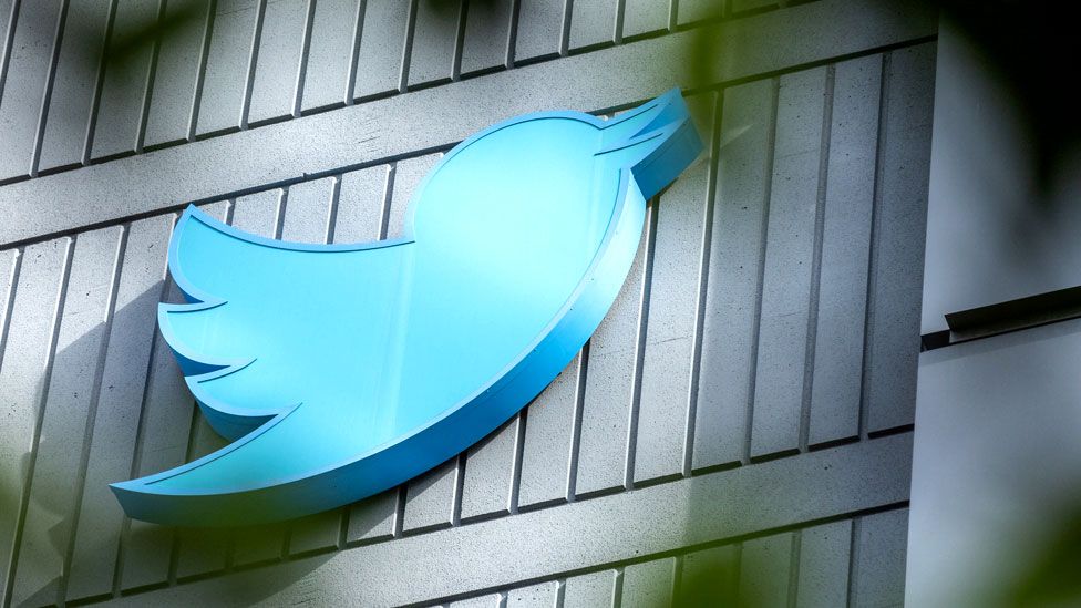 The Twitter logo is seen on a sign on the exterior of Twitter headquarters in San Francisco, California, on 28 October 2022