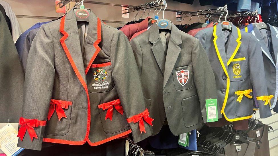 School uniforms hanging in Blossoms School Wear in East Kilbrid
