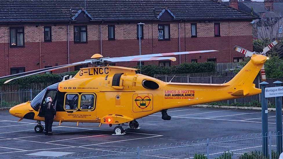 Lincs & Notts Air Ambulance on the ground in a car park