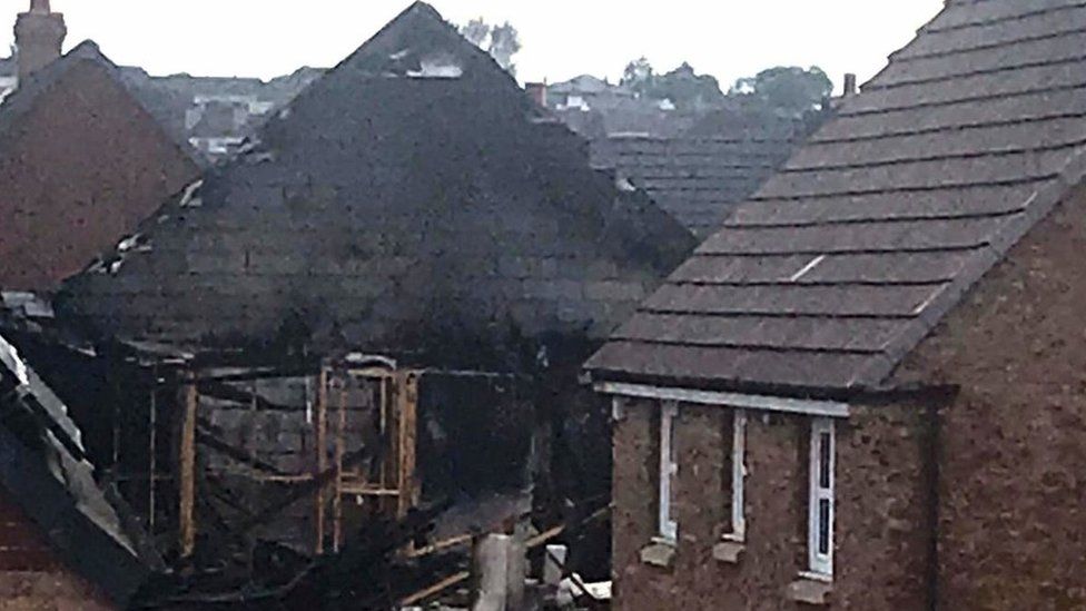 Airdrie fire: Body found in partially collapsed house - BBC News