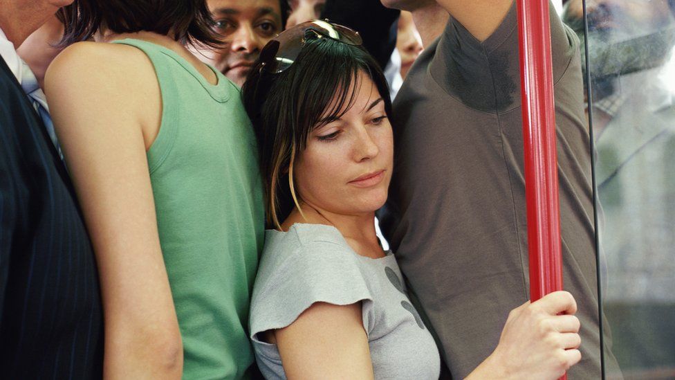 People squeezed on train