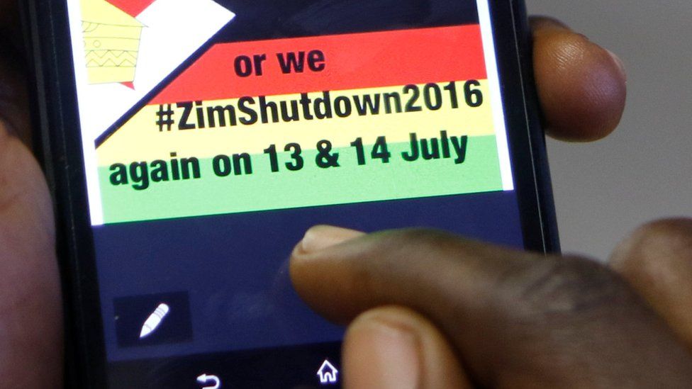 A man reading a message to shutdown Zimbabwe