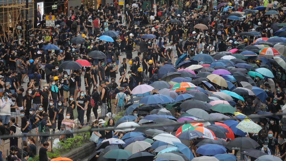 Protesters take part in a demonstration against what activists say is police violence in Hong Kong on July 28, 2019