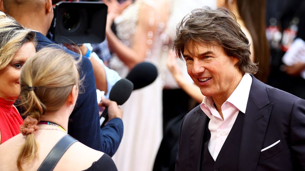 Cast member Tom Cruise speaks with the media as he attends the U.K. Premiere of 'Mission: Impossible - Dead Reckoning Part One' at the Odeon Luxe, London, Britain, June 22, 2023.