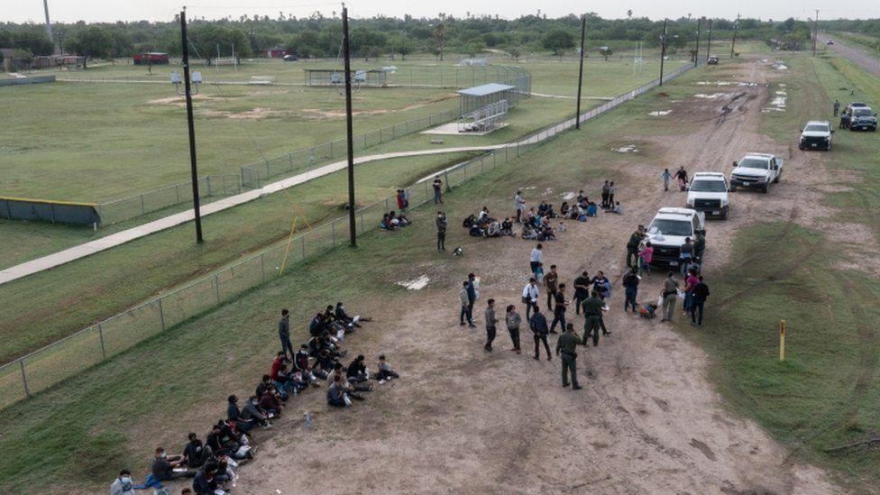 Asylum seeking unaccompanied minors from Central America are seen on the left in this aerial image after crossing the Rio Grande river into the United States from Mexico in La Joya, Texas, U.S., May 14, 2021