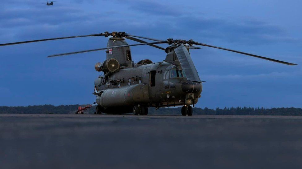 RAF Chinook on the runway at RAF Odiham as night falls 