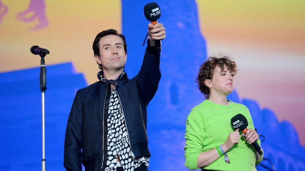 Nick Grimshaw and Annie Macmanus on stage 