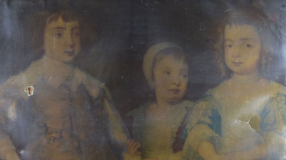 A close-up of an 18th Century print of a portrait of children of Charles II, hidden under layers of yellow varnish and with a hole on the right