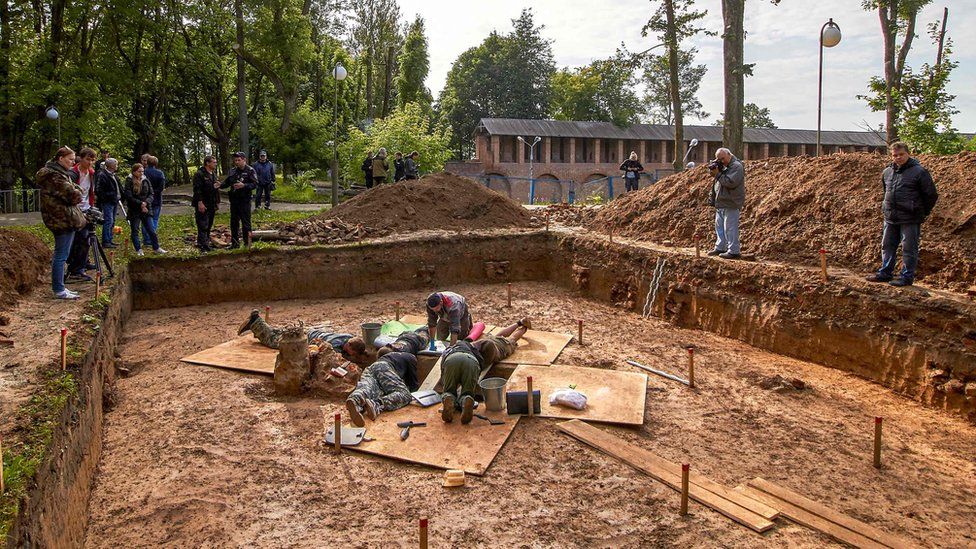 Archaeologists work at a site of the supposed burial place of French General Charles Etienne Gudin de la Sablonniere in Smolensk, Russia, 7 July 2019