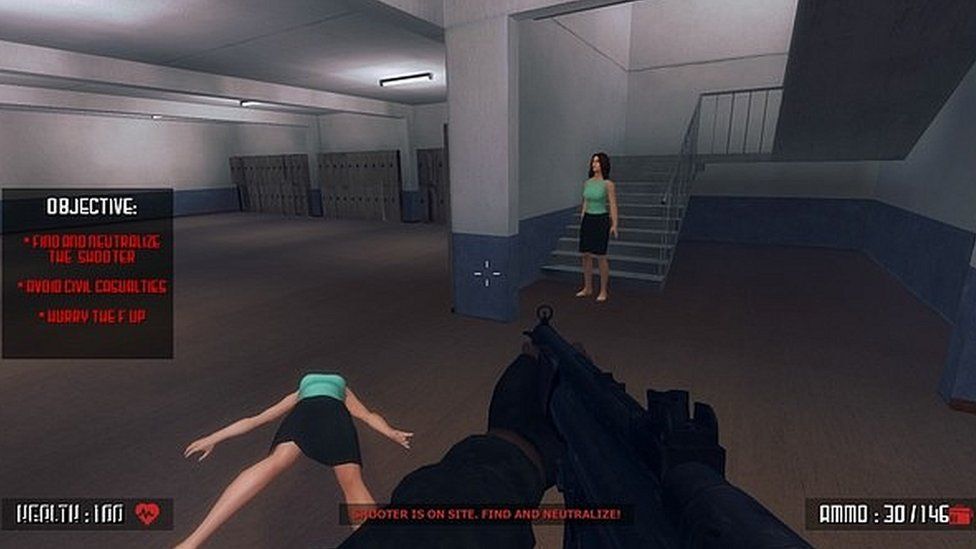 A computer-generated woman lies on the floor in a virtual school