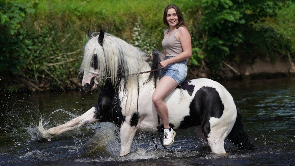 Woman on horse in river at Appleby Horse Fair 2022