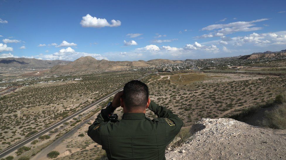 A US Border Patrol agent scans the US-Mexico border on 3 October