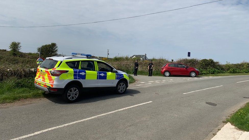Police at the scene of the incident near South Stack Road