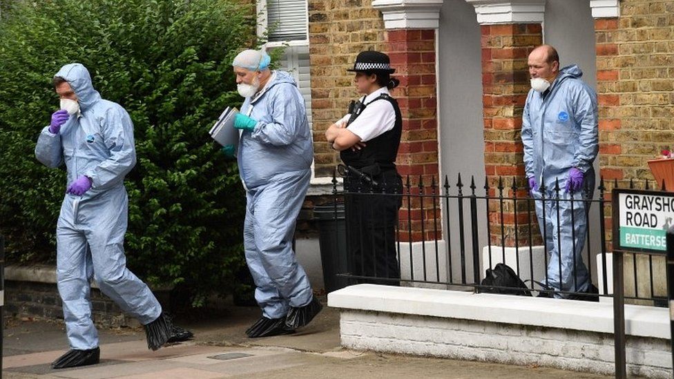 Forensic officers at house
