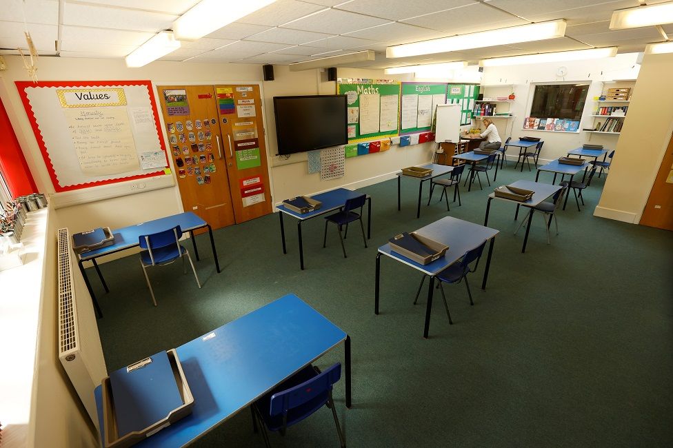 Tables are seen in a classroom as teacher Rhiannon Sharman makes preparations for Watlington Primary School to reopen to children on June 1, following the outbreak of the coronavirus disease