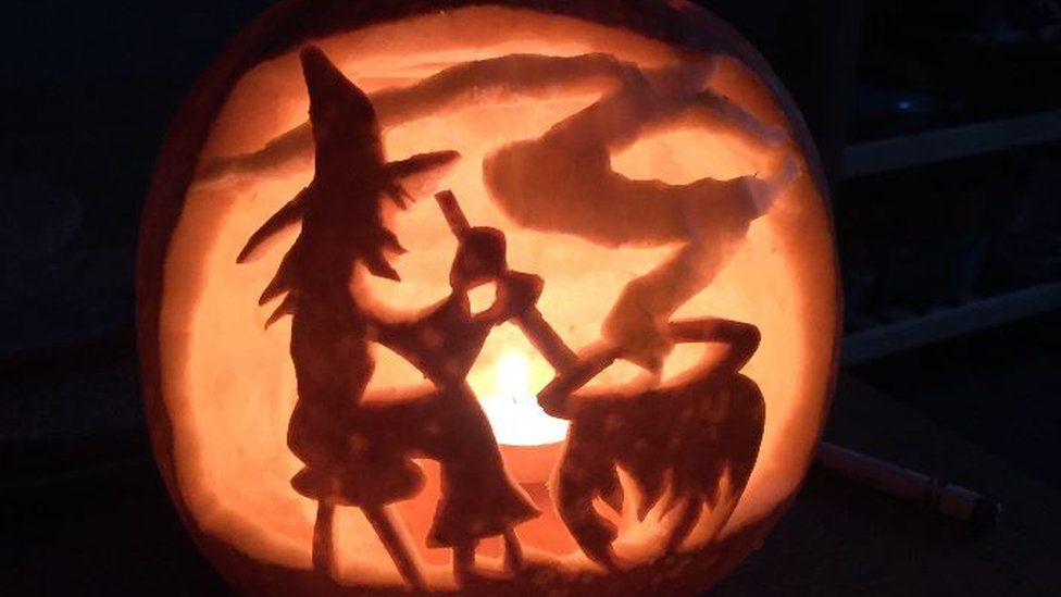 Witch carved in a pumpkin