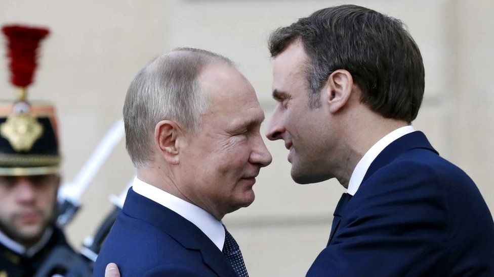 Presidents Putin and Macron meeting in 2019