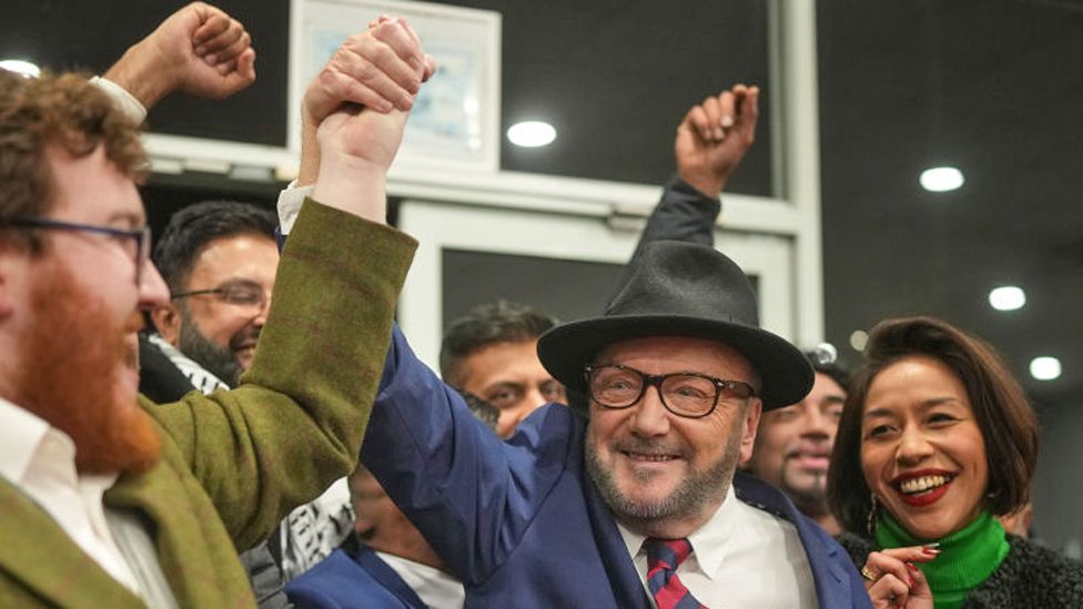 Workers Party of Britain candidate George Galloway celebrates with supporters at his campaign headquarters after being declared the winner in the Rochdale by-election on February 29, 2024