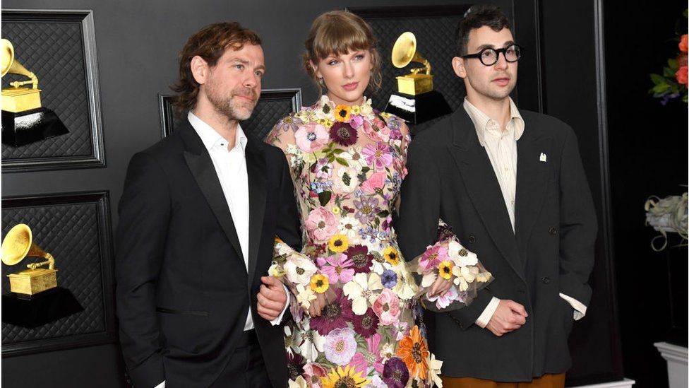Bryce Dessner, Taylor Swift and Jack Antonoff at the Grammy Awards, after winning album of the year for Folklore in 2021