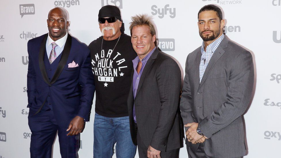 Titus with Hulk Hogan in 2014