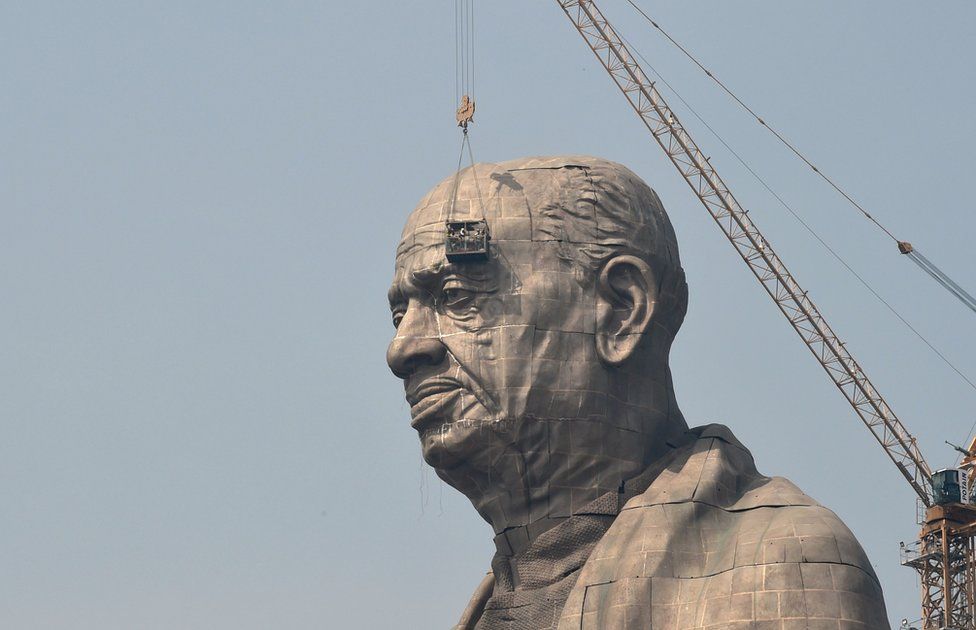 Indian workers give the finishing touches to the world's tallest statue dedicated to Indian independence leader Sardar Vallabhbhai Patel in India's western Gujarat state.