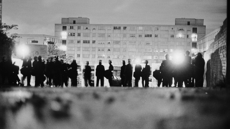 Police officers on the Broadwater Farm housing estate he morning after the riot of 6th October 1985.