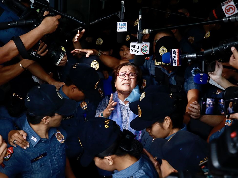 Former senator Leila De Lima (C) reacts after attending a court hearing in Muntinlupa city, Metro Manila, Philippines, 13 November 2023.