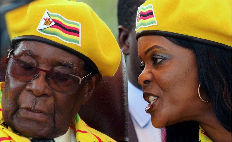 Grace Mugabe talks in Robert Mugabe's ear on 8 November 2017