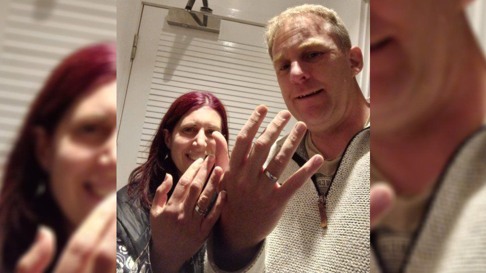 Richard and Anne Whetter posing with wedding rings