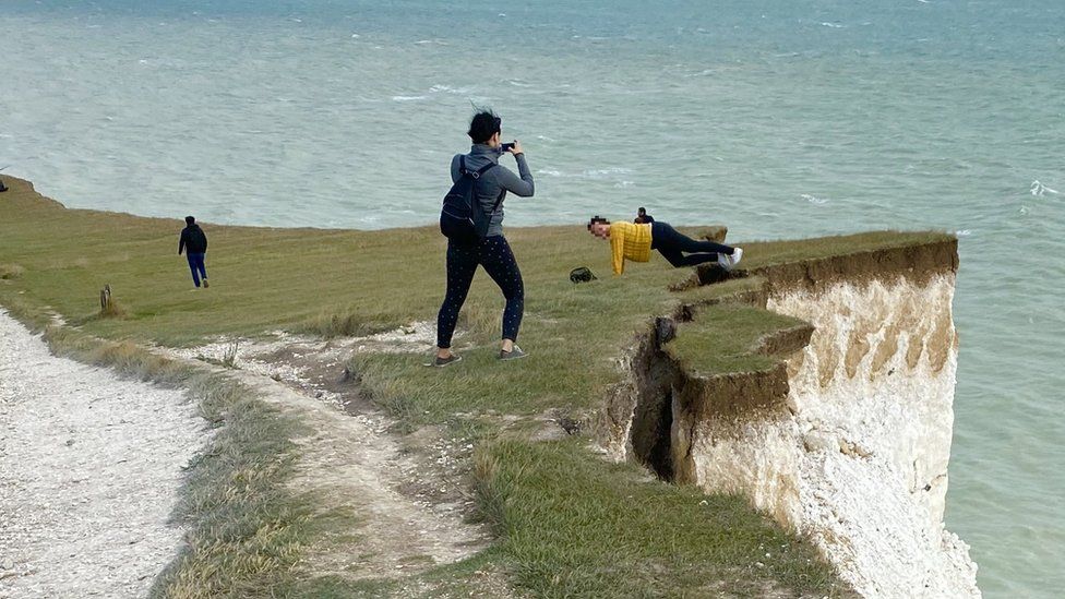 People on cliff edge
